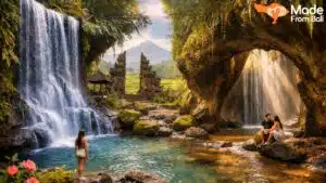 Hidden Bali waterfall surrounded by jungle and stone arch, with visitors exploring a quiet natural pool.
