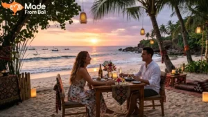 Couple enjoying a romantic beachfront dinner in Bali during sunset by the ocean.